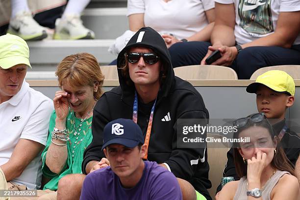 Stefanos Tsitsipas of Greece watches from the stands as Paula Badosa of Spain plays against Darya Kasatkina of Australia in the Women's Singles Third...