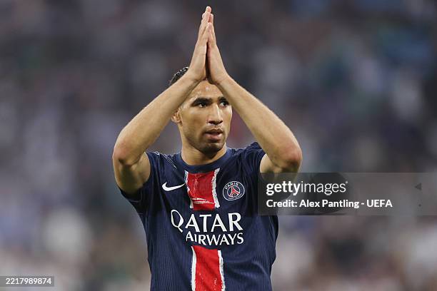 Achraf Hakimi of Paris Saint-Germain holds up his hands as he celebrates scoring his team's first goal during the UEFA Champions League Final 2025...