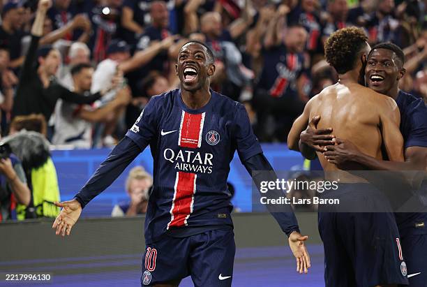 Ousmane Dembele of Paris Saint-Germain celebrates after Desire Doue of Paris Saint-Germain scores his team's third goal during the UEFA Champions...