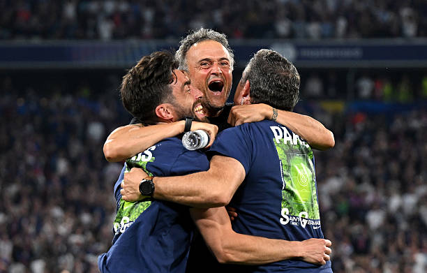 Luis Enrique, Head Coach of Paris Saint-Germain, celebrates with coaching staff after Khvicha Kvaratskhelia of Paris Saint-Germain scores his team's...