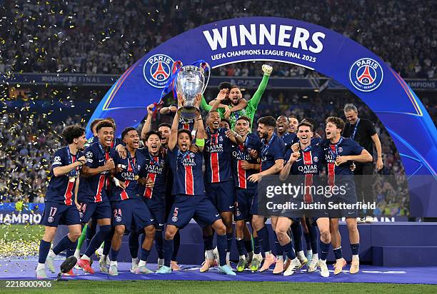 Marquinhos of Paris Saint-Germain lifts the UEFA Champions League trophy after his team's victory, to secure Paris Saint-Germain's first ever UEFA...