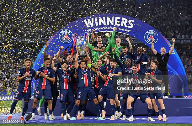 Marquinhos of Paris Saint-Germain lifts the UEFA Champions League trophy after his team's victory, to secure Paris Saint-Germain's first ever UEFA...