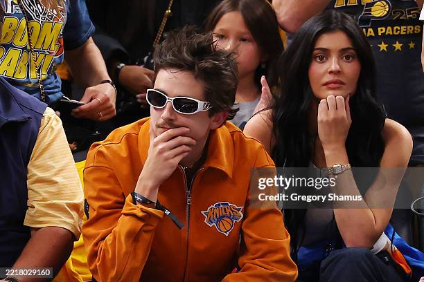 Timothee Chalamet and Kylie Jenner look on during the fourth quarter Game Six of the Eastern Conference Finals of the 2025 NBA Playoffs between the...