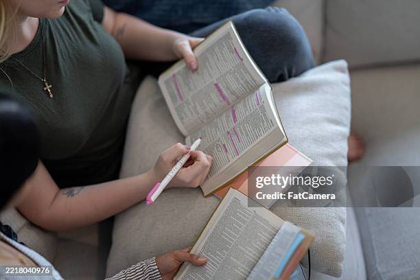 women engaged in group bible study with highlighted text and notes - bibel bildbanksfoton och bilder