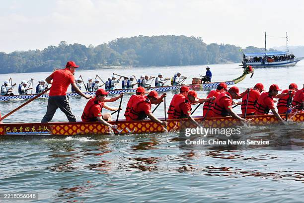 People take part in a dragon boat race to celebrate the Dragon Boat Festival, also known as Duanwu Festival, on May 31, 2025 in Sao Paulo, Brazil.