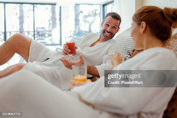 wellness and self-care concept with couple at luxury spa - sun lounger stock pictures, royalty-free photos & images
