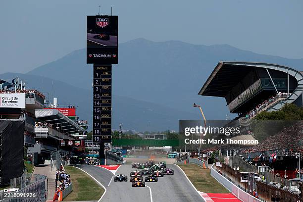 Oscar Piastri of Australia driving the McLaren MCL39 Mercedes leads Max Verstappen of the Netherlands driving the Oracle Red Bull Racing RB21 Lando...