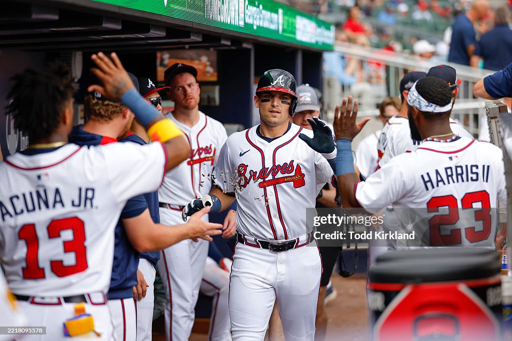 Roger Riley Arizona Diamondbacks Austin Riley of the Atlanta Braves reacts with teammates after... News ...
