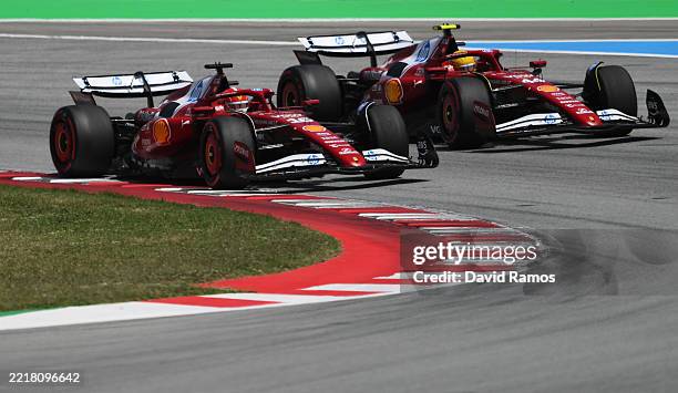Charles Leclerc of Monaco driving the Scuderia Ferrari SF-25 and Lewis Hamilton of Great Britain driving the Scuderia Ferrari SF-25 battle for track...