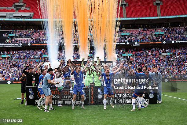 Charlie Raglan and Tom Conlon of Oldham Athletic lift the trophy following victory in the Vanarama National League Promotion Play-off Final between...