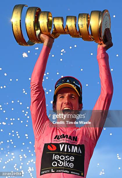 Simon Yates of Great Britain and Team Visma | Lease a Bike celebrates at podium as Pink Leader Jersey winner with the Trofeo Senza Fine during the...