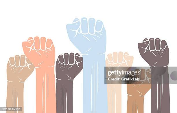 vector raised fists showing unity, solidarity in diversity - raised fist graphic stock illustrations