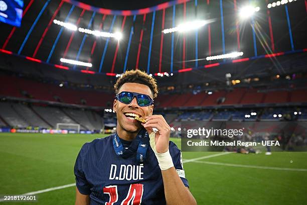 Desire Doue of PSG celebrates with his winners medal after winning the UEFA Champions League Final 2025 between Paris Saint-Germain and FC...