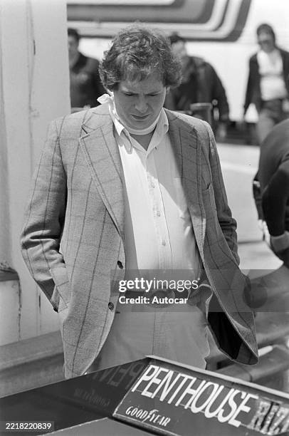 Hesketh team owner Lord Alexander Hesketh looks at the rear of the Hesketh 308E Ford at the Spanish GP, Circuito Permanente Del Jarama, Madrid,...
