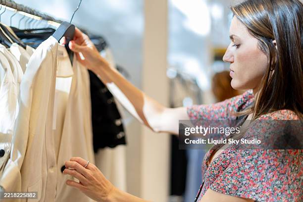 Clothes Customer Customer Choosing Clothes In Fashion Store High-Res Stock Photo - Getty ...
