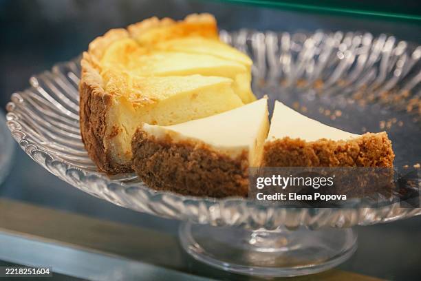 fresh homemade lemon cakes and cheesecake in small local cafeteria - zuckerfrei stock-fotos und bilder