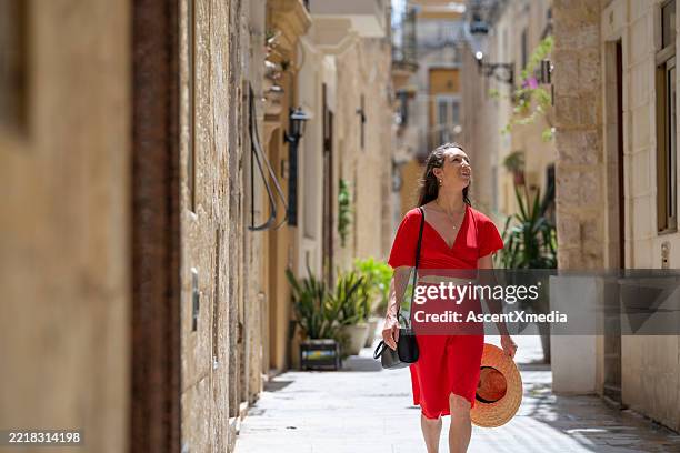 woman explores narrow streets, malta - maltese islands stock pictures, royalty-free photos & images