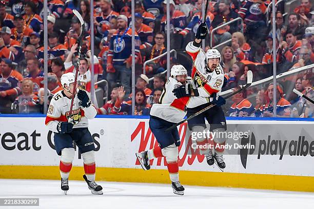 Brad Marchand of the Florida Panthers celebrates his game winning goal in double overtime with teammates Jesper Boqvist and Anton Lundell to defeat...