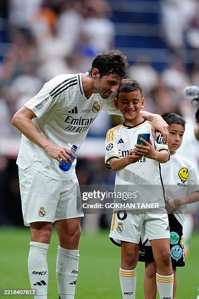 Esteban Granero of Real Madrid Legends takes selfie with kids during the Corazon Classic Match 2025 between Real Madrid Legends and Borussia Legends...