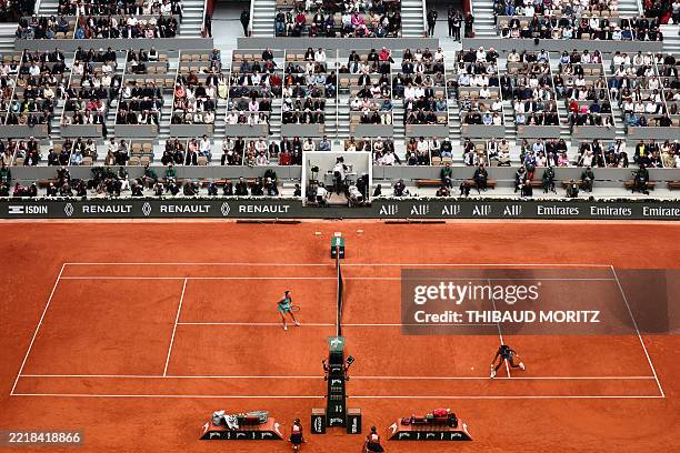 Spectators watch US Coco Gauff playing against Belarus' Aryna Sabalenka during their women's singles final match on day 14 of the French Open tennis...