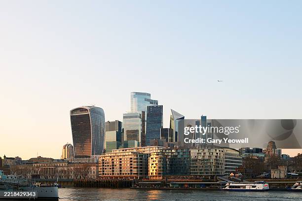 london city skyline and river thames at dusk - thames embankment stock pictures, royalty-free photos & images