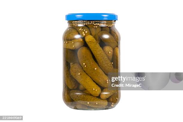 pickled gherkins in glass jar isolated on white background - cetriolino foto e immagini stock