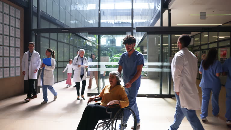 https://media.gettyimages.com/id/2218472469/video/busy-hospital-entrance-with-patients-and-healthcare-workers-walking-by.jpg?b=1&s=640x640&k=20&c=pMucJTJ2Ii2PFbOaS_BVbvCpbz_z6wHjpnAJEjaEl3A=