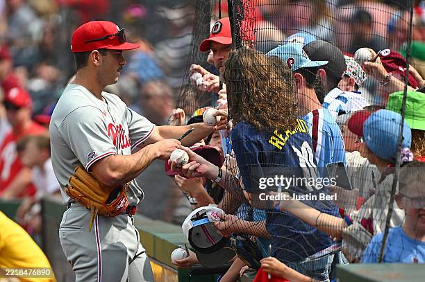 Otto Kemp of the Philadelphia Phillies signs autographs for fans before making his MLB debut during the game against the Pittsburgh Pirates at PNC...