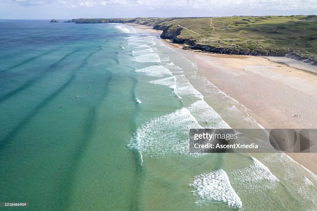 Aerial view of bay, beach and rugged headland