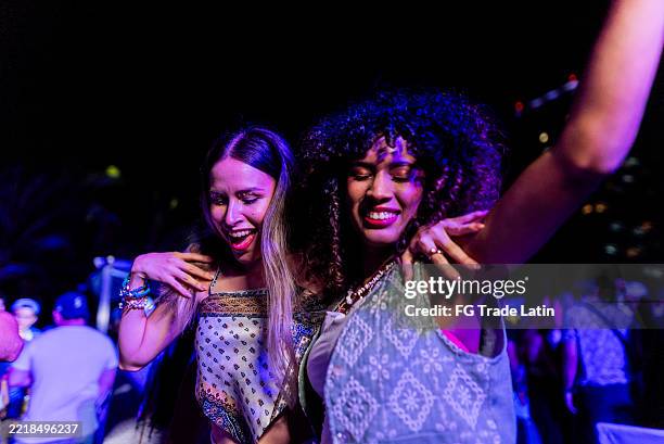 young friends women dancing during party outdoors - dance music stock pictures, royalty-free photos & images