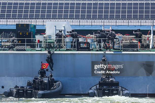 Taiwan Coast Guard Special Task Unit members simulate a response to a vessel hijacking emergency, during a joint-forces exercise in Kaohsiung,...