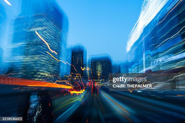 abstract city lights motion blur - focus on foreground stock pictures, royalty-free photos & images