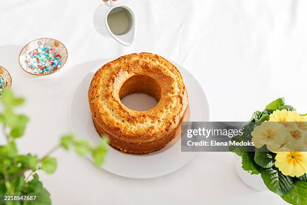 chef pouring syrup on a delicious ring cake for dessert decoration - sponge cake stock pictures, royalty-free photos & images