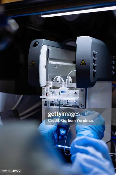 mechatronics engineer servicing industrial machine - mechanical engineering stock pictures, royalty-free photos & images