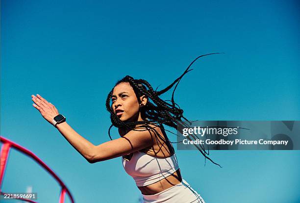 attractive young woman with braided hair wearing smartwatch, running - sport stock pictures, royalty-free photos & images