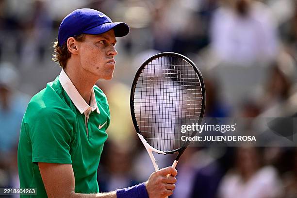 Italy's Jannik Sinner reacts after a point during his men's singles final match against Spain's Carlos Alcaraz on day 15 of the French Open tennis...