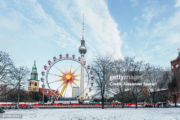 tv tower (fernsehturm) and christmas market ferris wheel in berlin, germany - berlin winter stock pictures, royalty-free photos & images