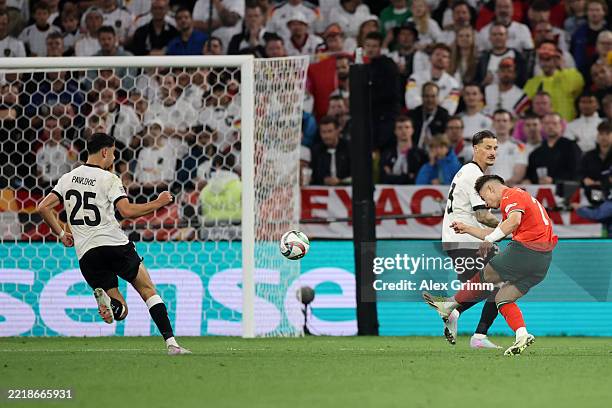 Francisco Conceicao of Portugal scores his team's first goal during the UEFA Nations League 2025 semifinal match between Germany and Portugal at...