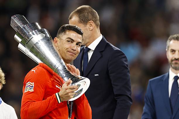 Cristiano Ronaldo of Portugal with the Nations League trophy during the UEFA Nations League final Portugal v. Spain at the Munich Football Arena on...
