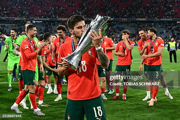Portugal s Midfielder Ruben Neves Celebrates With The Trophy After portugal-s-midfielder-ruben-neves-celebrates-with-the-trophy-after