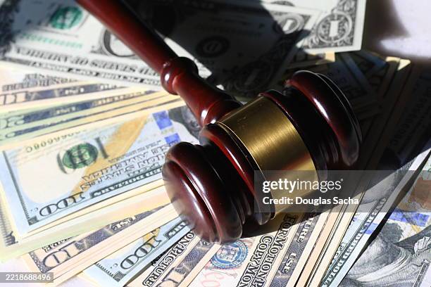 personal injury suing concept - cash, and judges gavel - lawsuit stock pictures, royalty-free photos & images