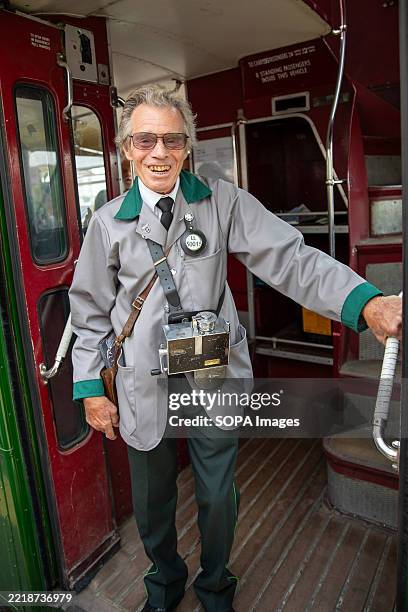 Conductor Train/bus A bus conductor stands at the back of a classic London bus.... News ...