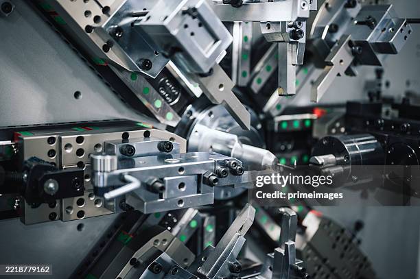 automatic industry robotic lathe system shaping metal component in real-time during industrial automation process - metal industry stock pictures, royalty-free photos & images