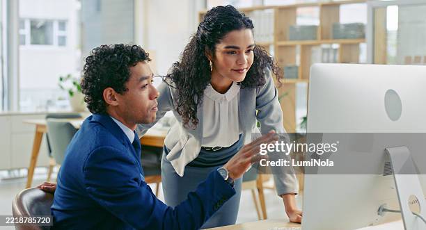 two professionals collaborating on a project in a modern office setting - neat stock pictures, royalty-free photos & images