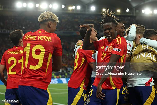 Lamine Yamal of Spain celebrates scoring his team's third goal with teammate Nico Williams during the UEFA Nations League 2025 semifinal match...