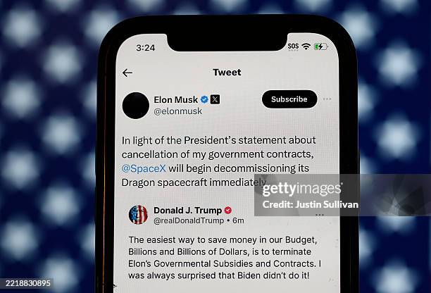 In this photo illustration, social media posts by U.S. President Donald Trump and Elon Musk are displayed on a smartphone on June 05, 2025 in San...