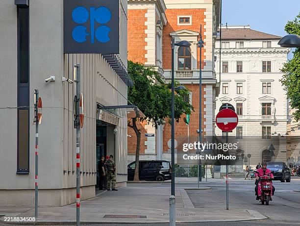 Armed security personnel and Austrian military soldiers stand guard outside the headquarters of the Organization of the Petroleum Exporting Countries...