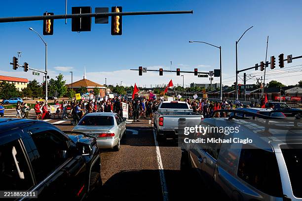 Anti-ICE protestors march toward the ICE Processing Center on June 9, 2025 in Aurora, Colorado. The Trump administration has called in the National...