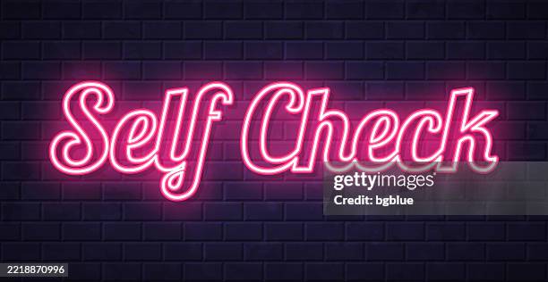 self check - glowing neon text on brick wall background - self service check in stock illustrations