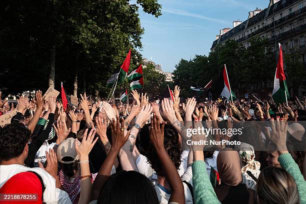 Participants gather during a rally to show their support for activists aboard a boat stopped by Israeli forces en route to deliver aid to Gaza, in...